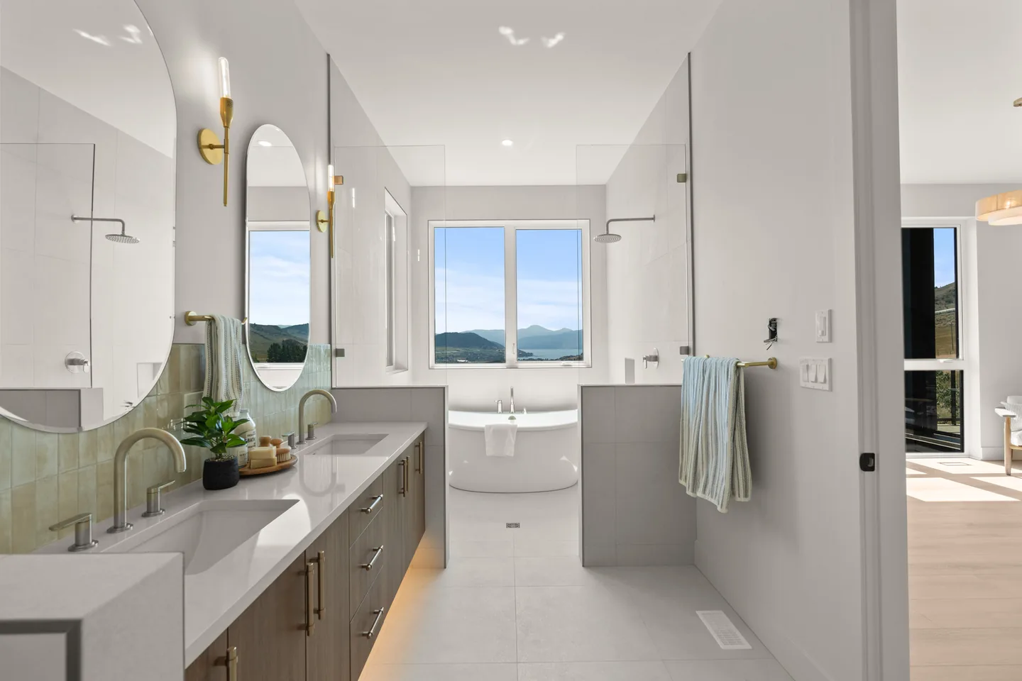 Primary ensuite with double vanity and freestanding tub
